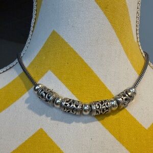 Elegant Silver Necklace with Intricate Detailing